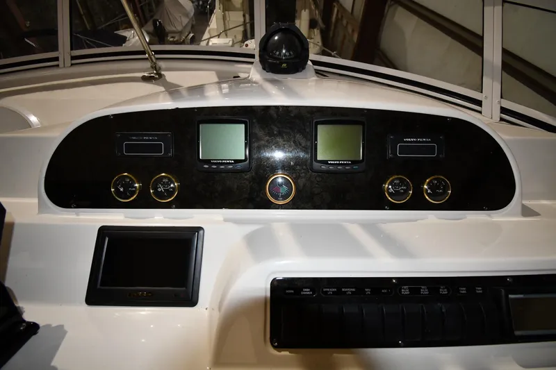 Slide: The Image of Dashboard of a 2003 Cruisers Yachts 5000 Sedan Sport with navigation instruments. - 22