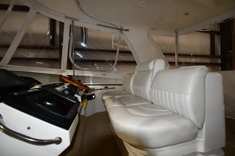 Slide: The Image of Interior of 2003 Cruisers Yachts 5000 Sedan Sport with white leather seating. - 23