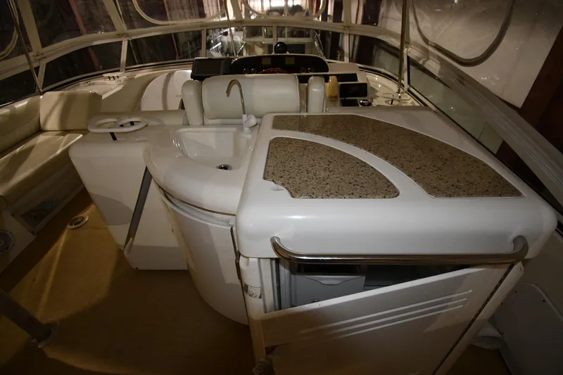 Slide: The Image of 2003 Cruisers Yachts 5000 Sedan Sport interior with sink and seating area. - 27