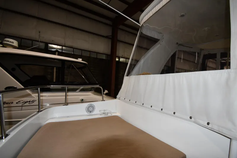 Slide: The Image of 2003 Cruisers Yachts 5000 Sedan Sport interior with white canopy and seating area. - 29