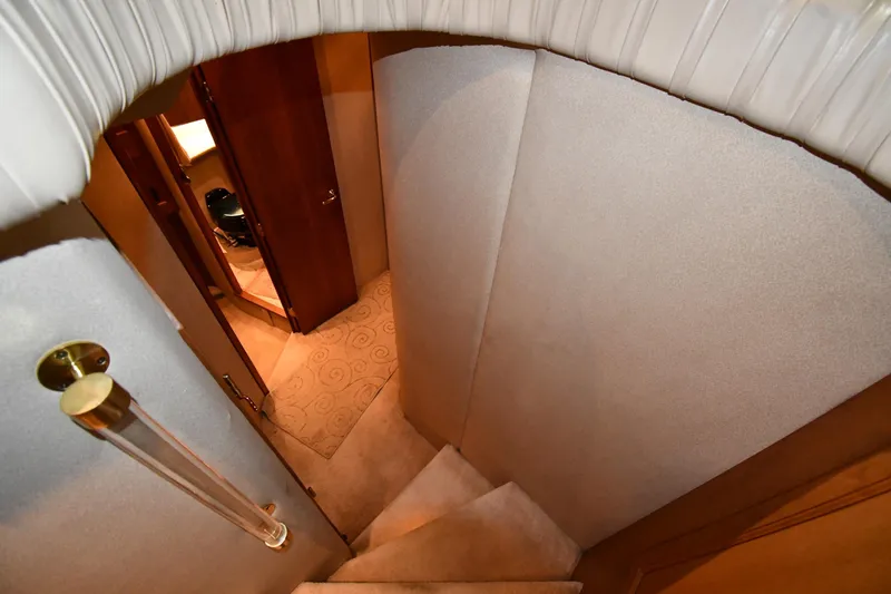 Slide: The Image of Interior staircase of 2003 Cruisers Yachts 5000 Sedan Sport, featuring elegant design and carpeting. - 31