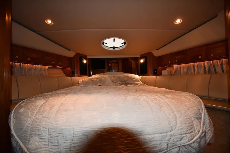 Slide: The Image of Luxurious bedroom interior of 2003 Cruisers Yachts 5000 Sedan Sport with elegant lighting. - 33