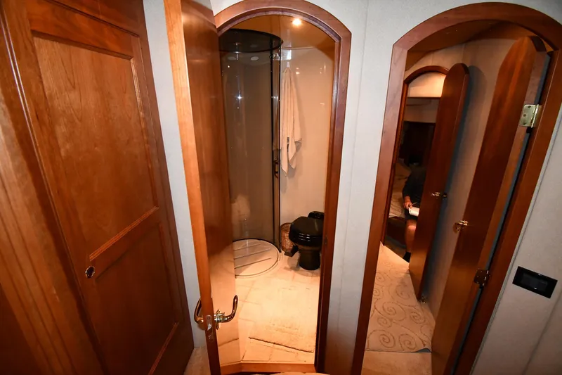 Slide: The Image of Interior of 2003 Cruisers Yachts 5000 Sedan Sport, featuring a compact bathroom. - 39