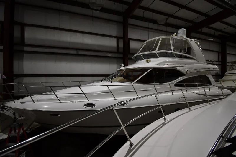 Slide: The Image of 2003 Cruisers Yachts 5000 Sedan Sport in indoor storage facility. - 4