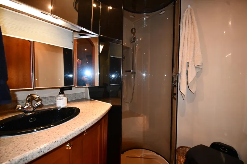Slide: The Image of Luxurious bathroom in 2003 Cruisers Yachts 5000 Sedan Sport with modern fixtures. - 40