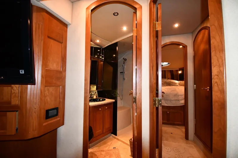 Slide: The Image of Luxurious interior of 2003 Cruisers Yachts 5000 Sedan Sport with wood finishes and modern amenities. - 47