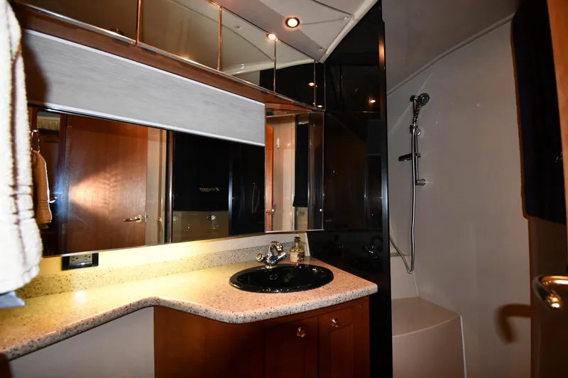 Slide: The Image of Luxurious bathroom in 2003 Cruisers Yachts 5000 Sedan Sport with modern fixtures. - 48