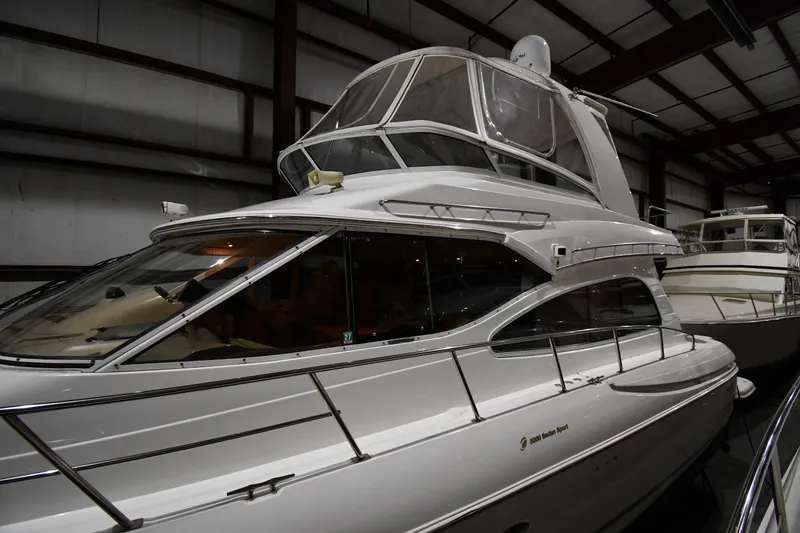 Slide: The Image of 2003 Cruisers Yachts 5000 Sedan Sport in indoor storage, showcasing sleek design and luxury features. - 5