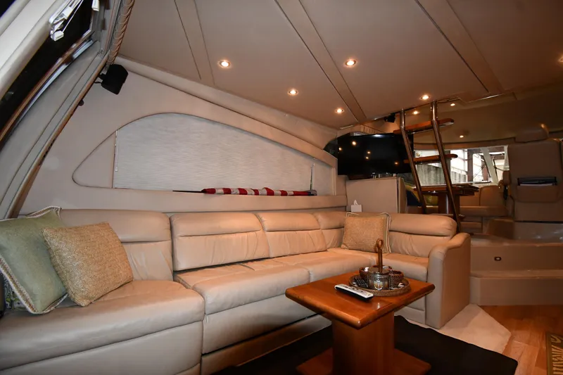 Slide: The Image of Luxurious interior of 2003 Cruisers Yachts 5000 Sedan Sport with plush seating and elegant decor. - 52
