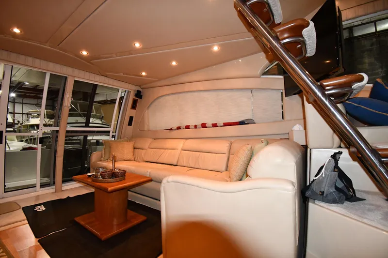 Slide: The Image of Luxurious interior of 2003 Cruisers Yachts 5000 Sedan Sport with plush seating and elegant decor. - 53