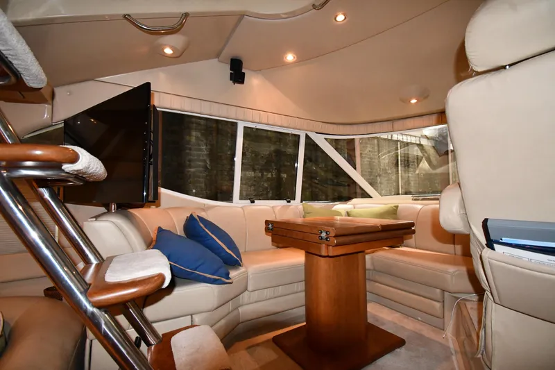 Slide: The Image of Luxurious interior of 2003 Cruisers Yachts 5000 Sedan Sport with plush seating and elegant decor. - 59