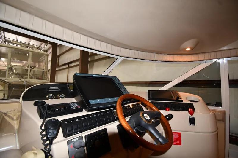 Slide: The Image of Interior cockpit of 2003 Cruisers Yachts 5000 Sedan Sport with navigation equipment. - 61
