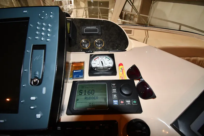 Slide: The Image of Control panel of 2003 Cruisers Yachts 5000 Sedan Sport with navigation equipment and accessories. - 64