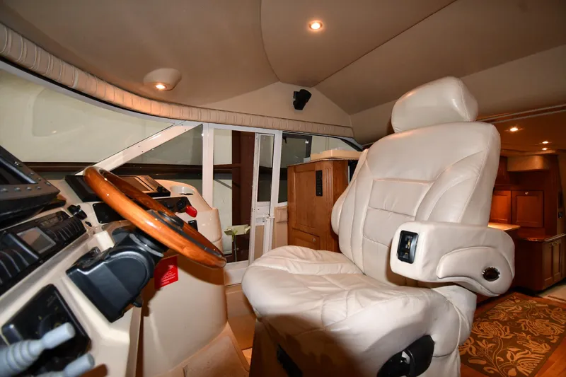Slide: The Image of Luxurious interior of 2003 Cruisers Yachts 5000 Sedan Sport with leather captain's chair. - 66