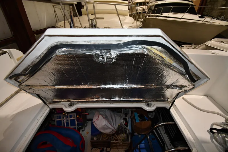Slide: The Image of Open engine compartment of a 2003 Cruisers Yachts 5000 Sedan Sport. - 69