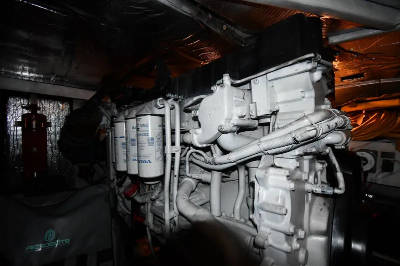 Slide: The Image of Engine room of a 2003 Cruisers Yachts 5000 Sedan Sport, featuring Volvo components. - 70