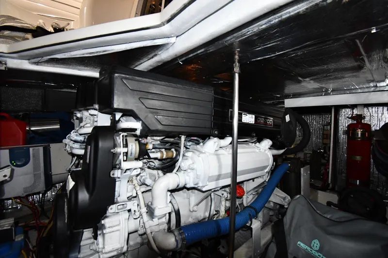 Slide: The Image of Engine room of a 2003 Cruisers Yachts 5000 Sedan Sport, showcasing mechanical components. - 71