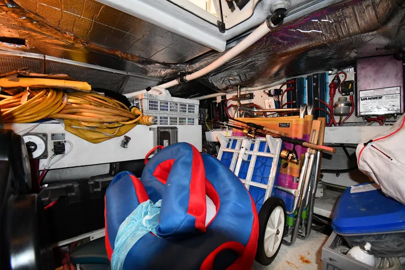 Slide: The Image of Storage area of 2003 Cruisers Yachts 5000 Sedan Sport with equipment and supplies. - 73