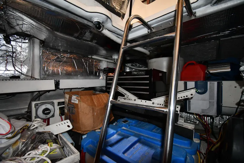 Slide: The Image of Engine room of 2003 Cruisers Yachts 5000 Sedan Sport with ladder and equipment. - 74