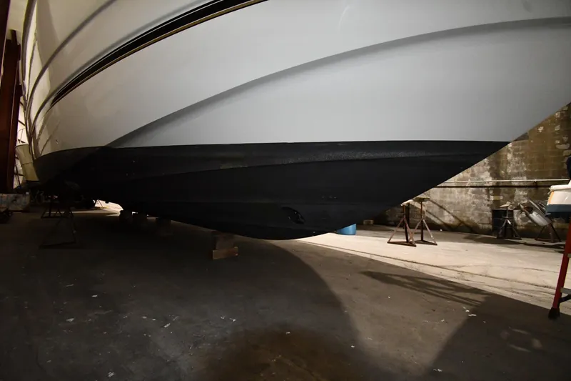 Slide: The Image of 2003 Cruisers Yachts 5000 Sedan Sport hull in indoor storage facility. - 76