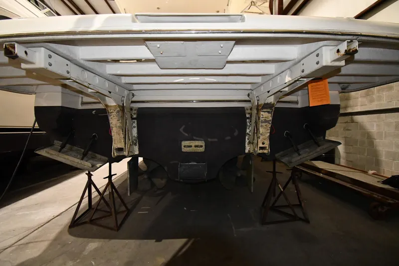 Slide: The Image of 2003 Cruisers Yachts 5000 Sedan Sport under maintenance in a storage facility. - 79