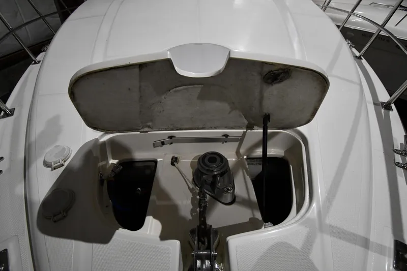 Slide: The Image of 2003 Cruisers Yachts 5000 Sedan Sport anchor compartment with open hatch. - 9