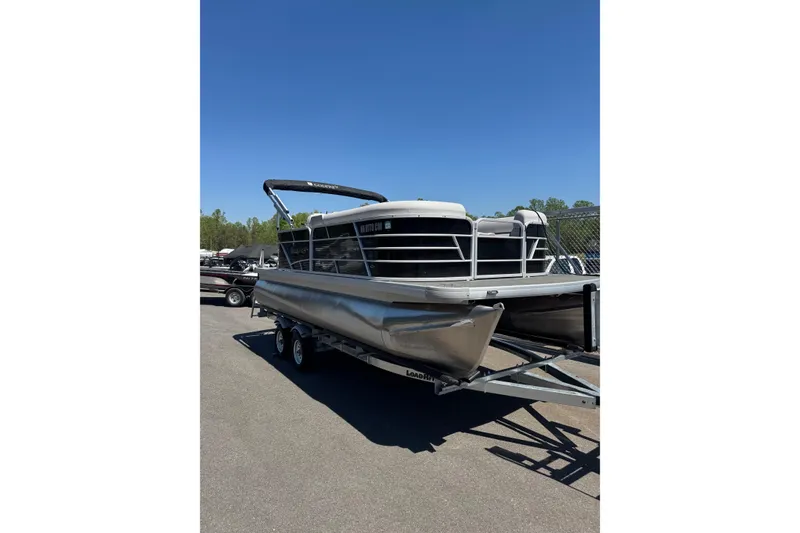 Slide: The Image of 2023 Godfrey Sweetwater 2086 SB pontoon boat on trailer under clear blue sky. - 4