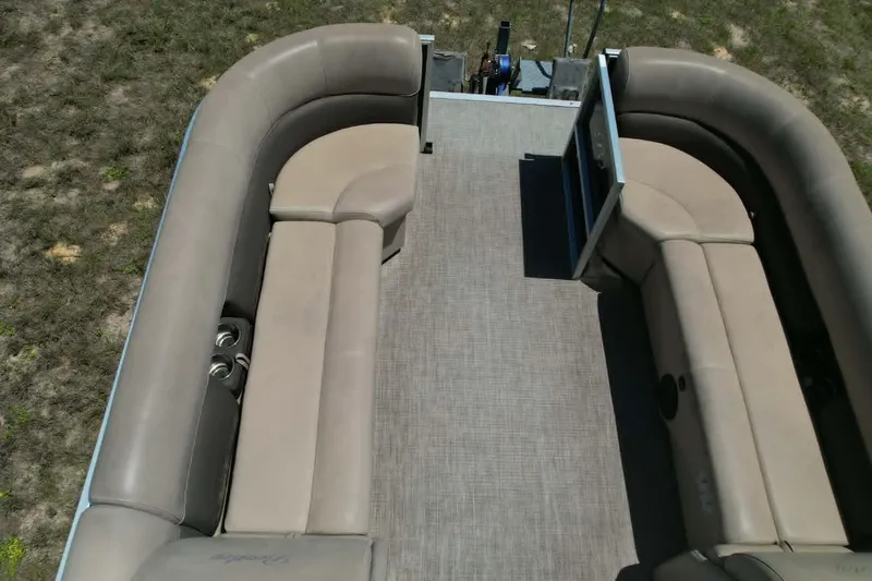 Slide: The Image of 2022 Bentley Pontoons 240 CRUISE interior with beige seating and spacious layout. - 5