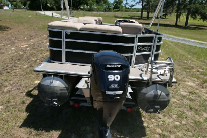 Slide: The Image of 2022 Bentley Pontoons 240 CRUISE with Mercury 90 GT engine, parked on grass. - 6