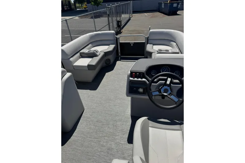 Slide: The Image of Interior of 2023 Godfrey Sweetwater 2086 SB pontoon boat with steering wheel and seating. - 3