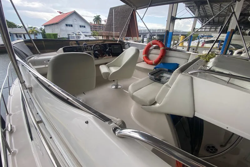 Slide: The Image of 2006 Regal Commodore 3880 yacht interior with helm, seating, and life preserver. - 14