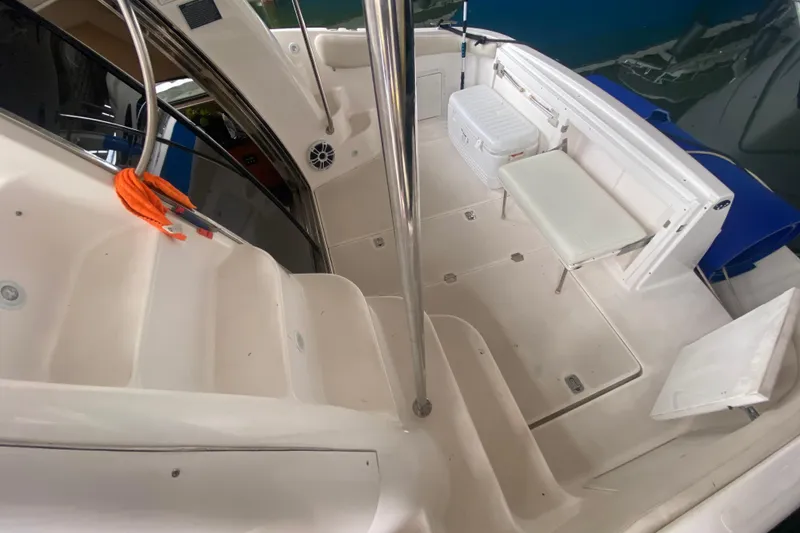 Slide: The Image of 2006 Regal Commodore 3880 boat interior with seating and storage compartments. - 16