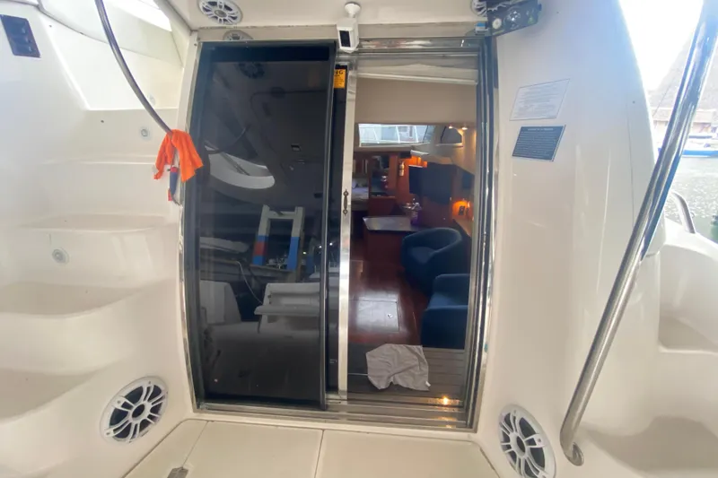 Slide: The Image of Interior view of 2006 Regal Commodore 3880 yacht, featuring cozy seating and modern amenities. - 26