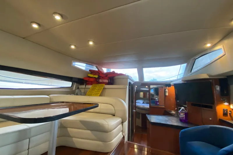 Slide: The Image of Luxurious interior of 2006 Regal Commodore 3880 yacht with modern seating and lighting. - 28