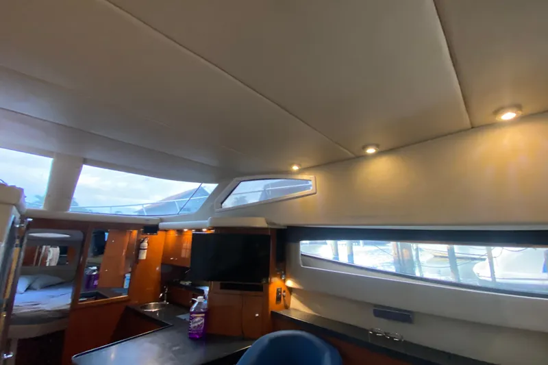 Slide: The Image of Interior of 2006 Regal Commodore 3880 yacht, featuring modern design and ample natural light. - 31