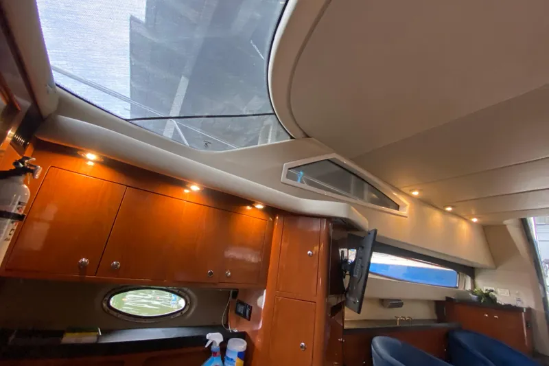 Slide: The Image of Interior of 2006 Regal Commodore 3880 yacht with wood cabinets and skylight. - 37