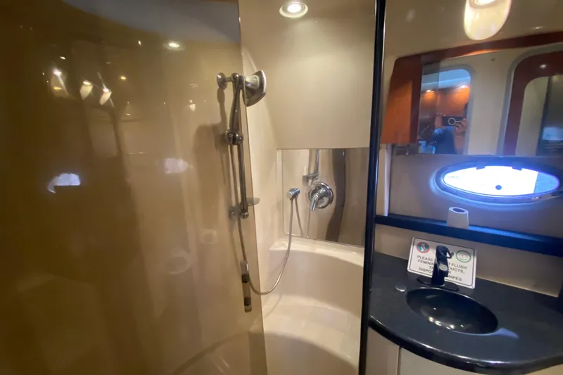 Slide: The Image of Luxurious bathroom in 2006 Regal Commodore 3880 yacht with shower and sink. - 41
