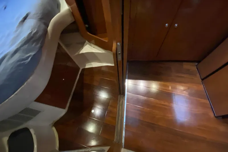 Slide: The Image of Interior of 2006 Regal Commodore 3880 yacht with polished wooden flooring. - 44