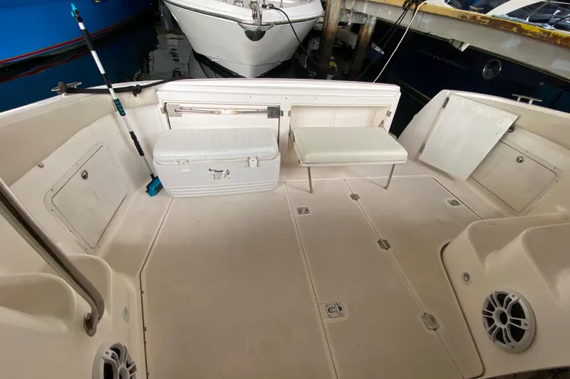 Slide: The Image of 2006 Regal Commodore 3880 boat deck with seating and storage compartments. - 46