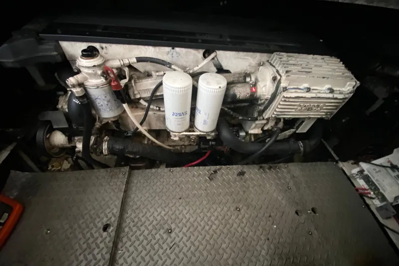 Slide: The Image of Engine compartment of a 2006 Regal Commodore 3880 boat, featuring Volvo Penta components. - 47