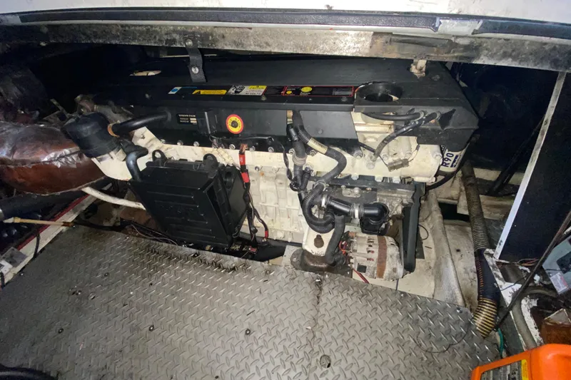 Slide: The Image of Engine compartment of a 2006 Regal Commodore 3880 boat, featuring mechanical components. - 48