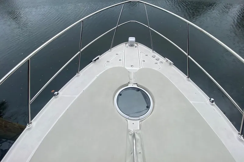 Slide: The Image of Bow view of 2006 Regal Commodore 3880 yacht on water. - 8