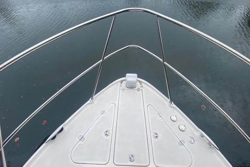 Slide: The Image of Top view of 2006 Regal Commodore 3880 boat bow on water. - 9
