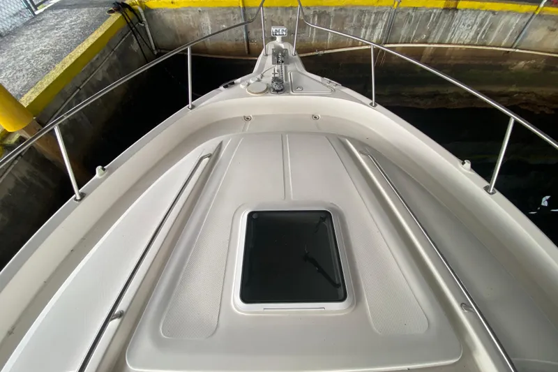 Slide: The Image of Bow view of 2000 Sea Ray 460 Express Cruiser in docked position. - 12