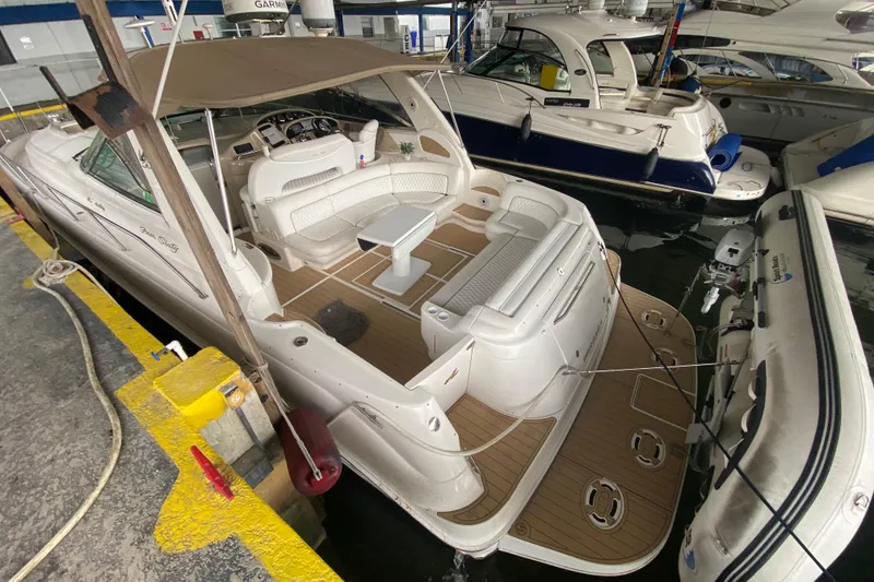 Slide: The Image of 2000 Sea Ray 460 Express Cruiser docked, featuring spacious seating and elegant design. - 16