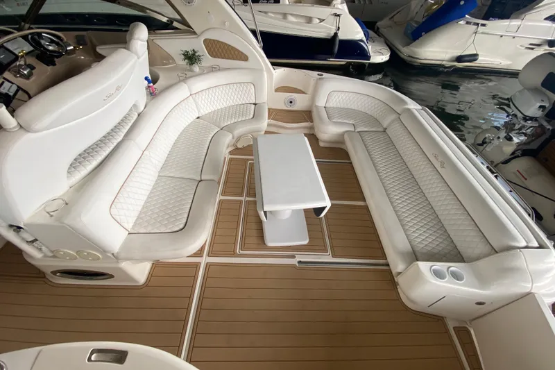 Slide: The Image of Luxurious interior of 2000 Sea Ray 460 Express Cruiser with elegant seating and table. - 17