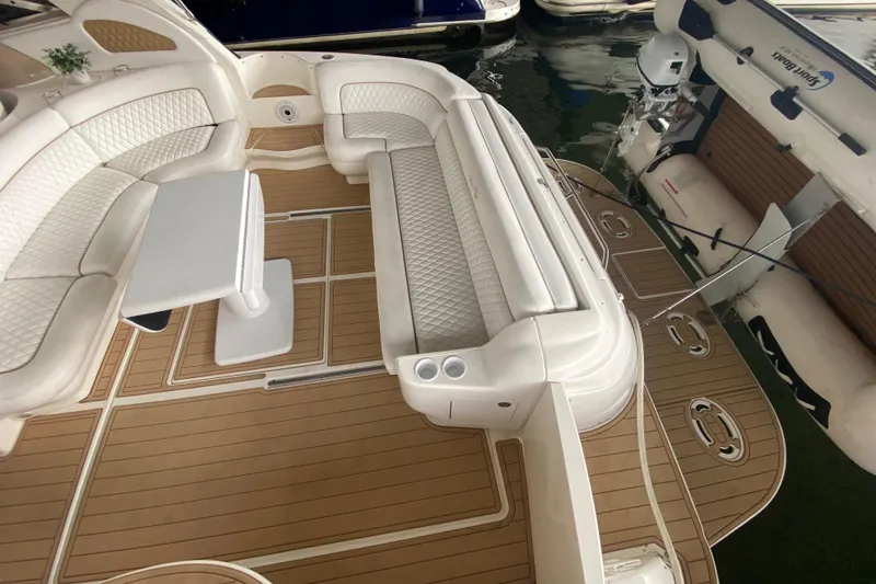 Slide: The Image of Luxurious interior of 2000 Sea Ray 460 Express Cruiser with elegant seating and table. - 18