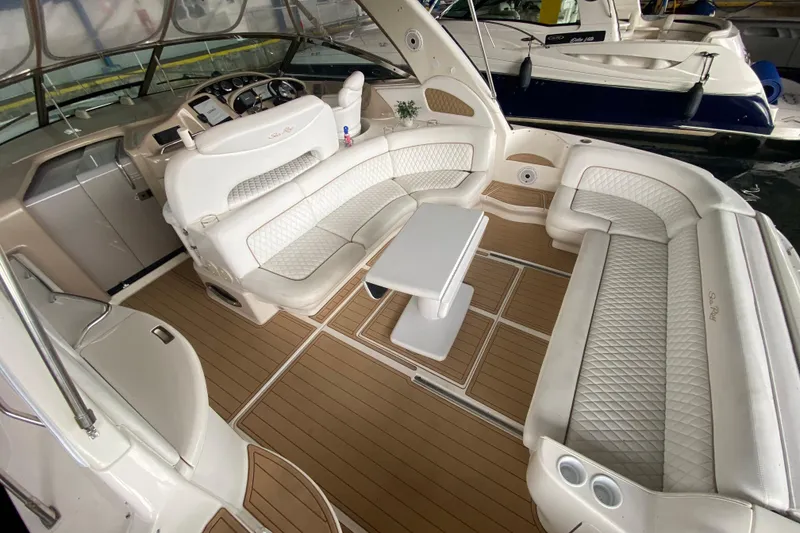Slide: The Image of Luxurious interior of 2000 Sea Ray 460 Express Cruiser with elegant seating and table. - 19