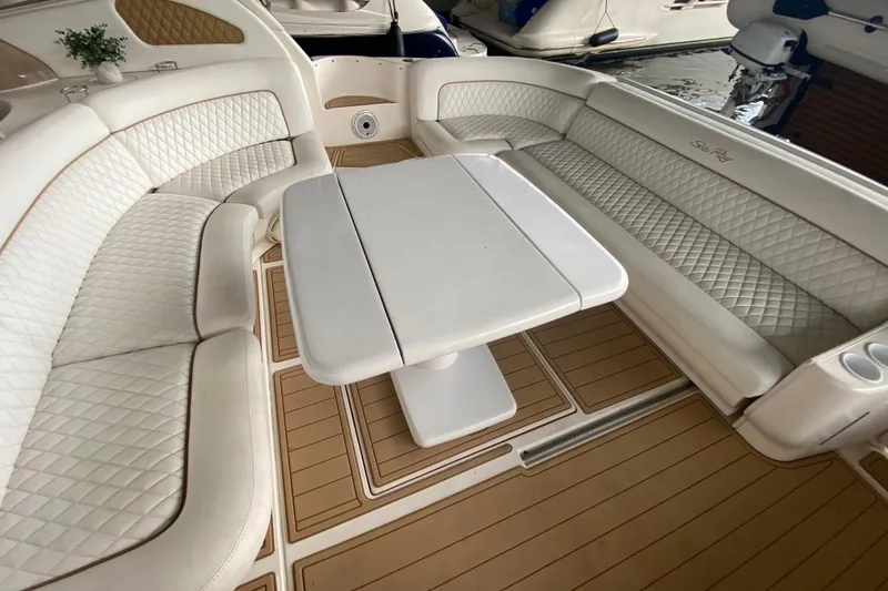 Slide: The Image of Luxurious seating area on a 2000 Sea Ray 460 Express Cruiser with elegant white upholstery. - 22