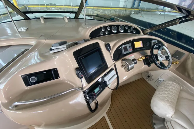 Slide: The Image of Helm of 2000 Sea Ray 460 Express Cruiser with modern navigation equipment and luxurious seating. - 24